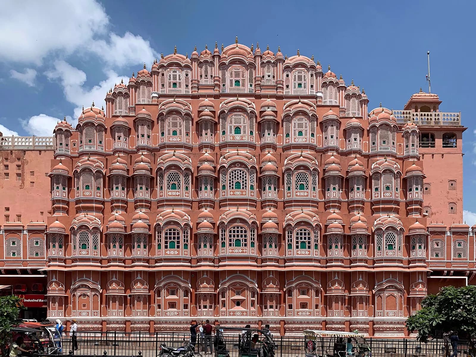 The pink sandstone facade and latticed windows of Hawa Mahal in Jaipur
