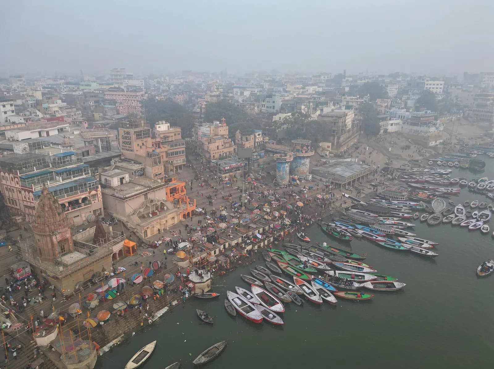 Pilgrims and boats at Dashashwamedh Ghat on the Ganga at Varanasi